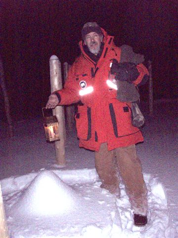 Forest Woodhenge - Winter Solstice night - Bill Frey Putting a lantern on Star Stump!