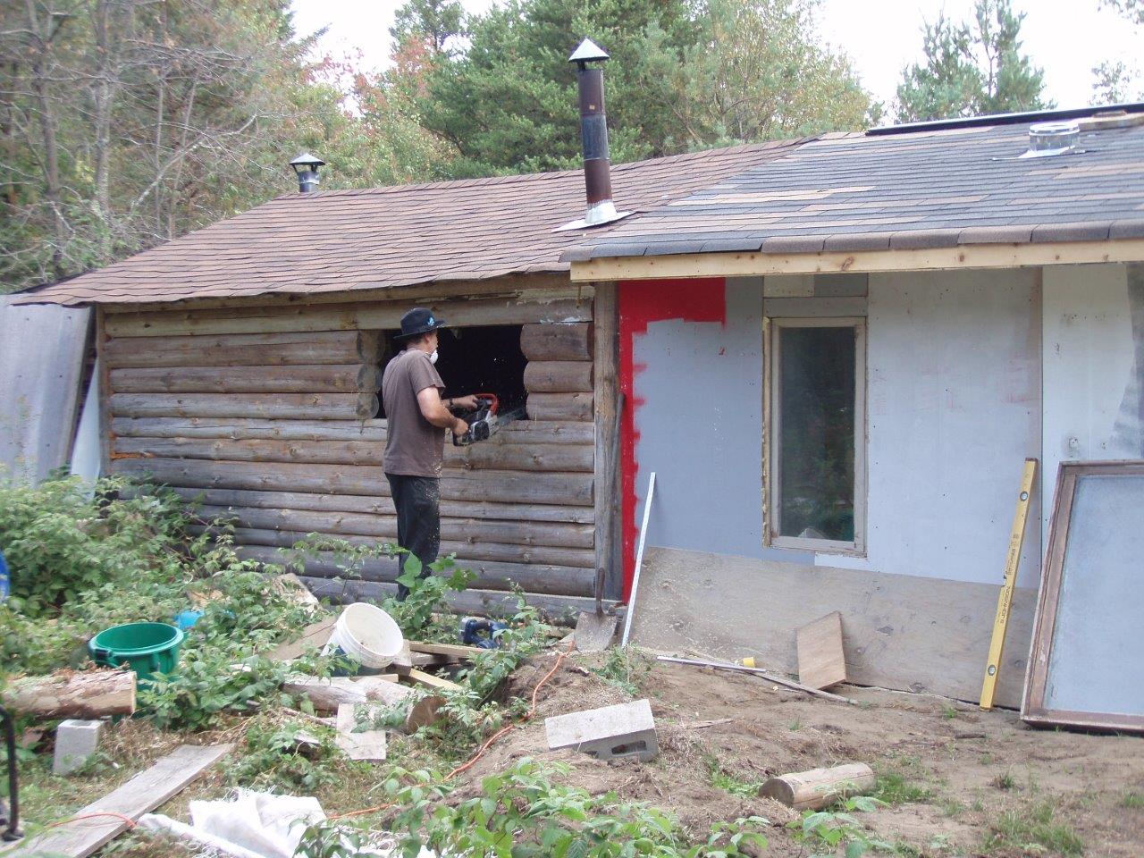 Bill Frey Cutting New Window in Log Cabin (4)