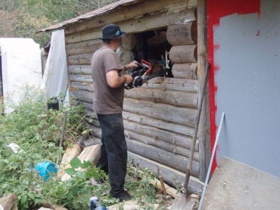 Bill Frey Cutting New Window in Log Cabin (3)